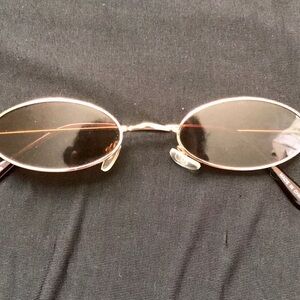 Gold and light brown Sunglasses with oval frames